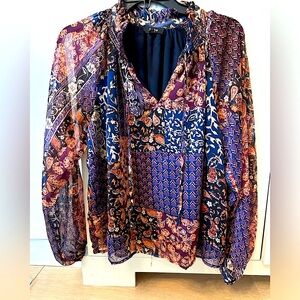 FATE Flowing patterned blouse size S with rust, blue, black maroon and gold.